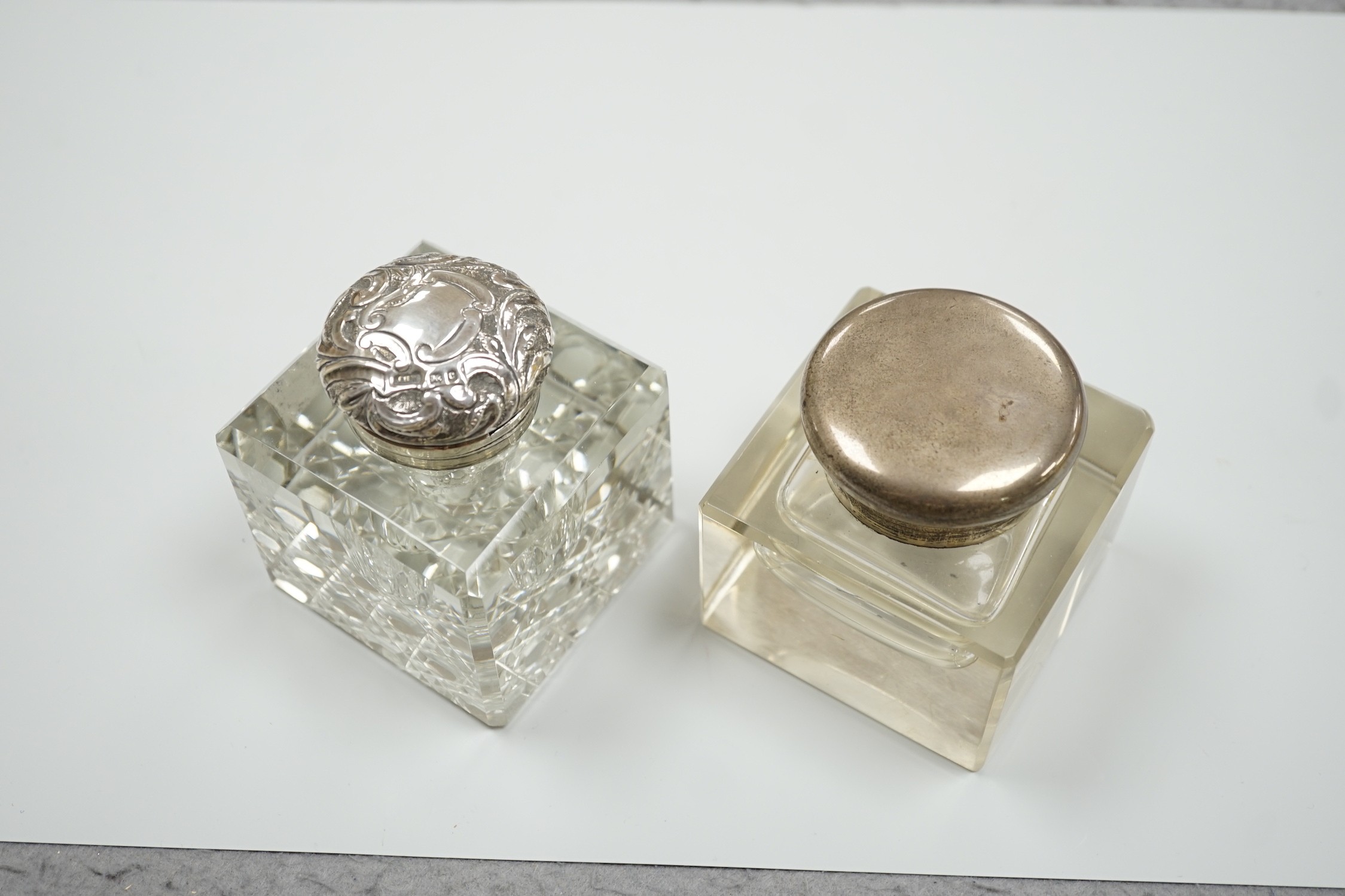 Two silver mounted cut glass inkwells, including Birmingham, 1902, height 92mm.